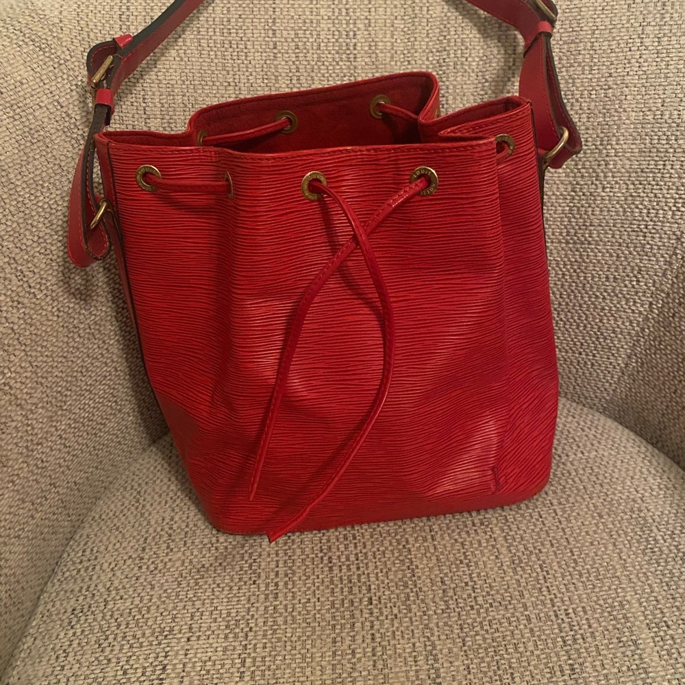 Louis Vuitton Red Shoulder Bag. This bag  comes with authentication.